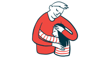 An adult and a child share a hug.