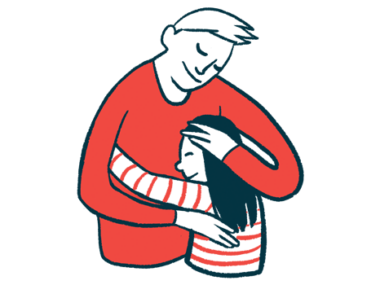 An adult and a child share a hug.