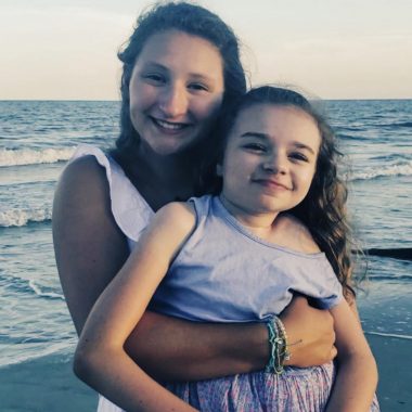 family | Rett Syndrome News | Linden holds her cousin Cammy during a vacation to Hilton Head, S.C., in 2019