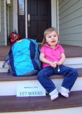 back to school | Rett Syndrome News | Cammy sits on the front porch of her house on her first day of preschool, March 13, 2012
