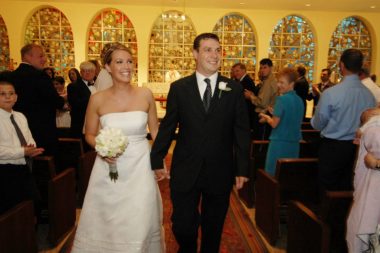 Rett syndrome diagnosis | Rett Syndrome News | photo of Jackie and Billy, holding hands in wedding clothes in a church
