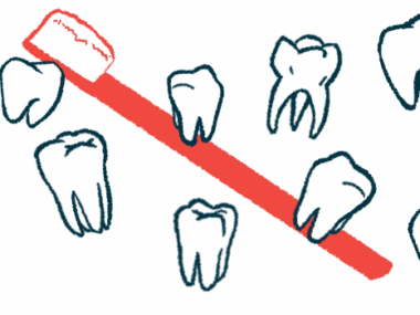 Nearly a dozen individual teeth are pictured with a toothbrush in the background.