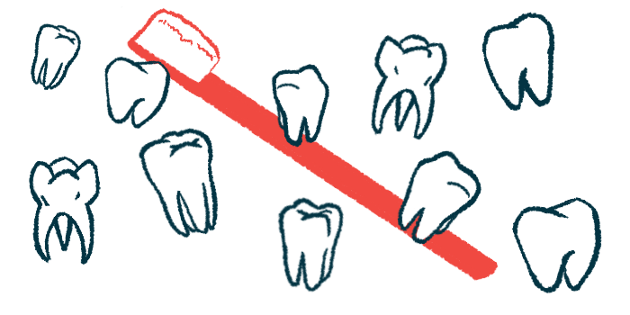 Nearly a dozen individual teeth are pictured with a toothbrush in the background.