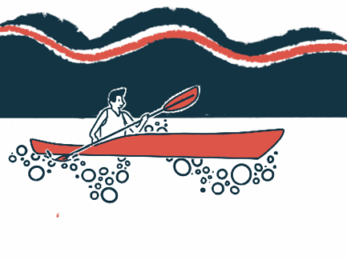 A kayaker out on the water is seen using a paddle.