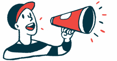 A boy in a cap shouts into a bullhorn.