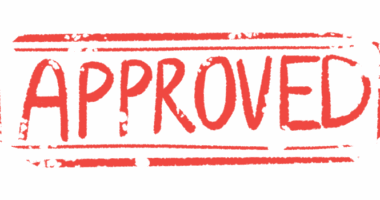 A red rubber stamp reads 